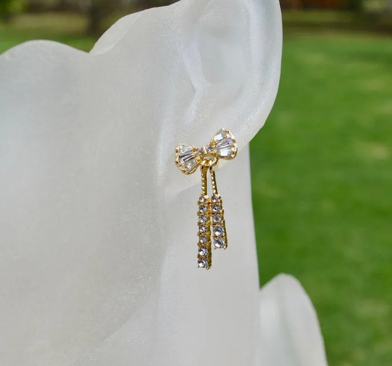 Crystal and gold bow earrings, dangle style