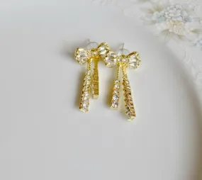 Crystal and gold bow earrings, dangle style