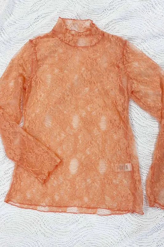 Floral lace top with long sleeves.