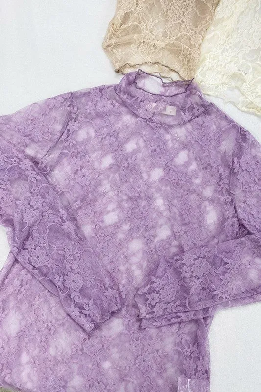 Floral lace top with long sleeves.