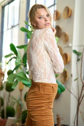 Floral lace top with long sleeves.