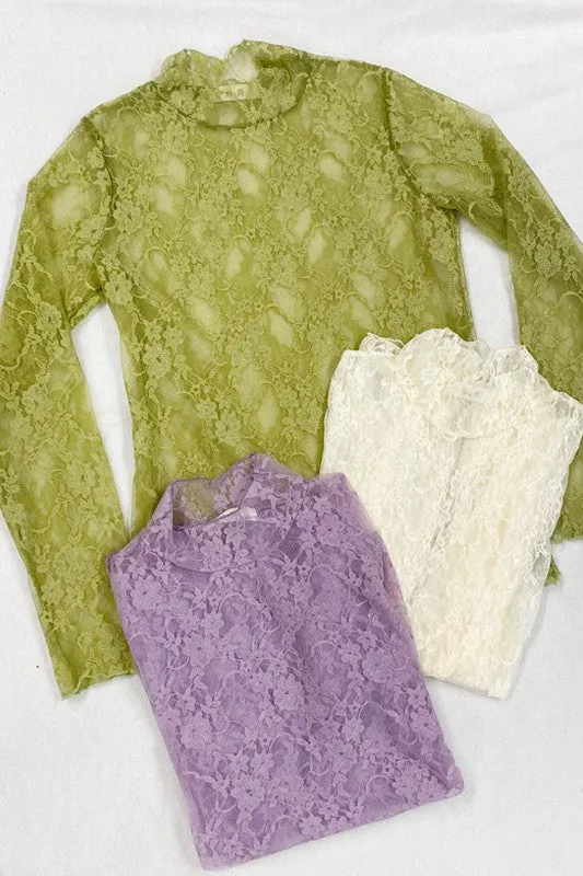 Floral lace top with long sleeves.